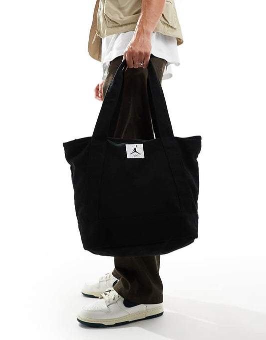 https://images.asos-media.com/products/jordan-flight-holdall-tote-bag-in-black/206499701-1-black?$n_750w$&wid=750&fit=constrain