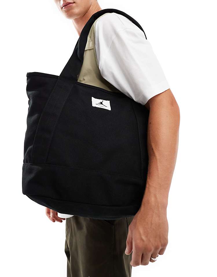 https://images.asos-media.com/products/jordan-flight-holdall-tote-bag-in-black/206499701-3?$n_750w$&wid=750&fit=constrain