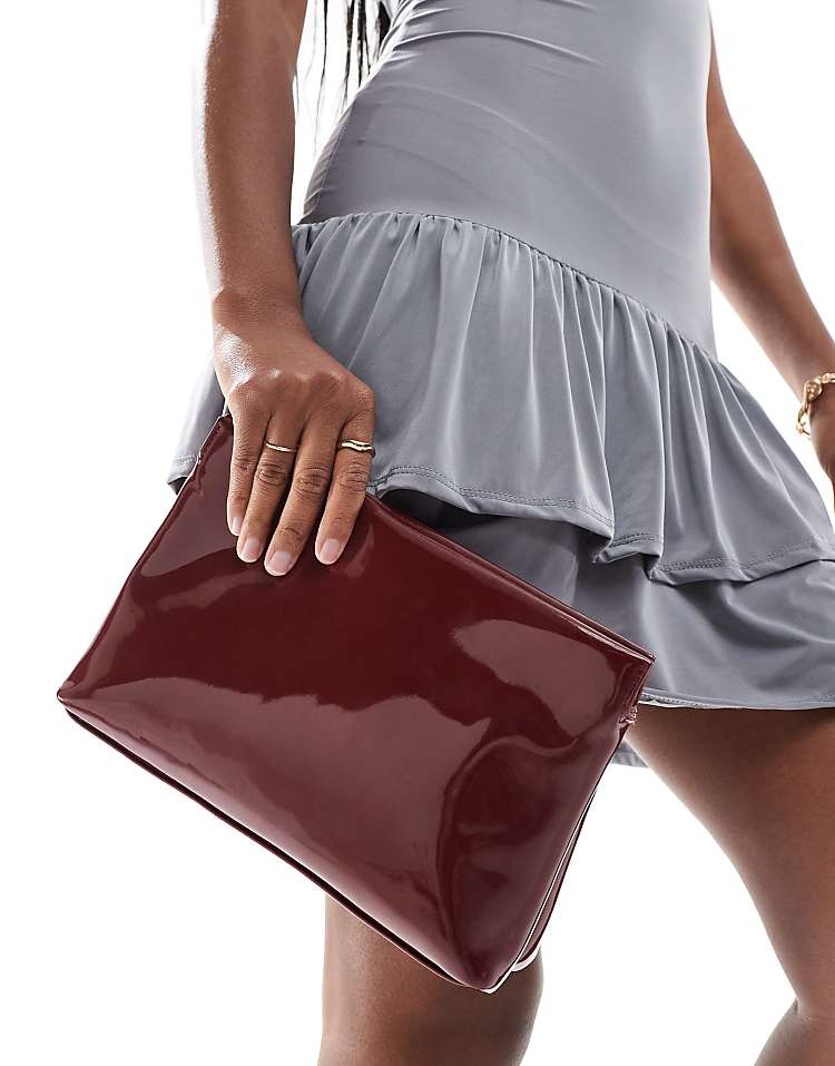 ASOS DESIGN zip top clutch in burgundy