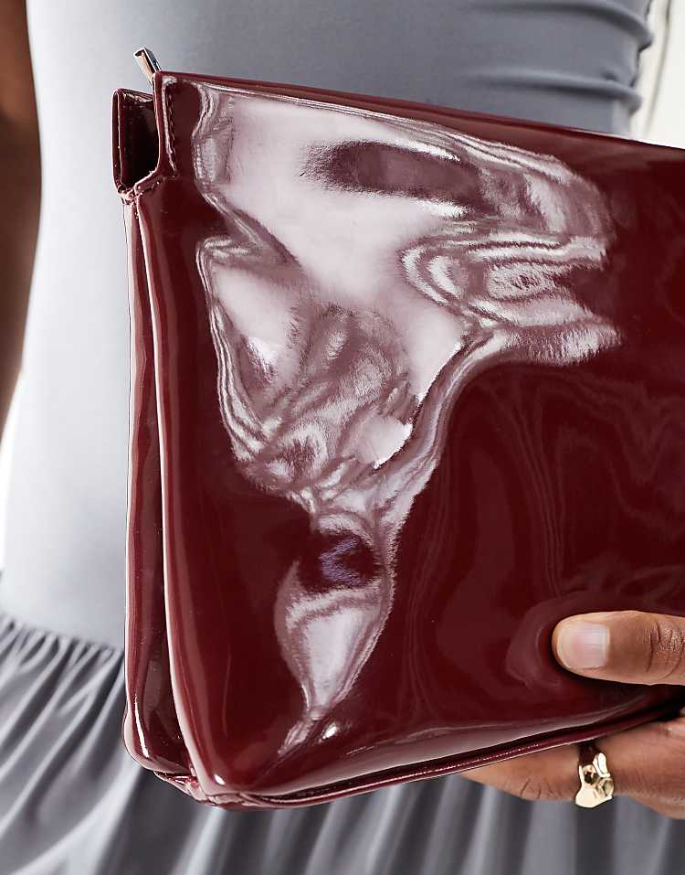 ASOS DESIGN zip top clutch in burgundy