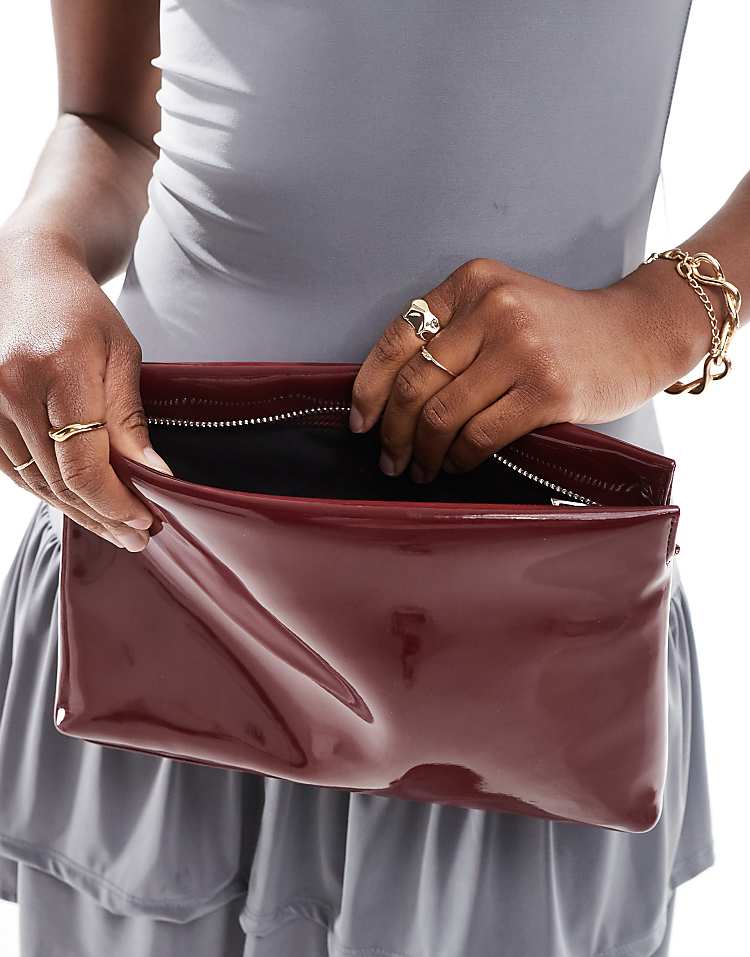 ASOS DESIGN zip top clutch in burgundy