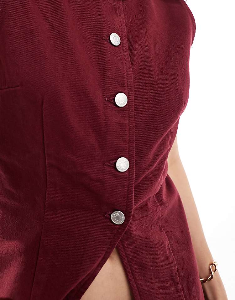 ASOS DESIGN denim split front waistcoat in burgundy