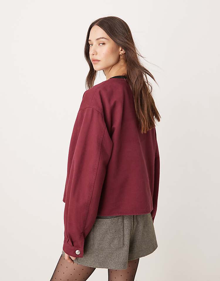 ASOS DESIGN denim collarless jacket in burgundy